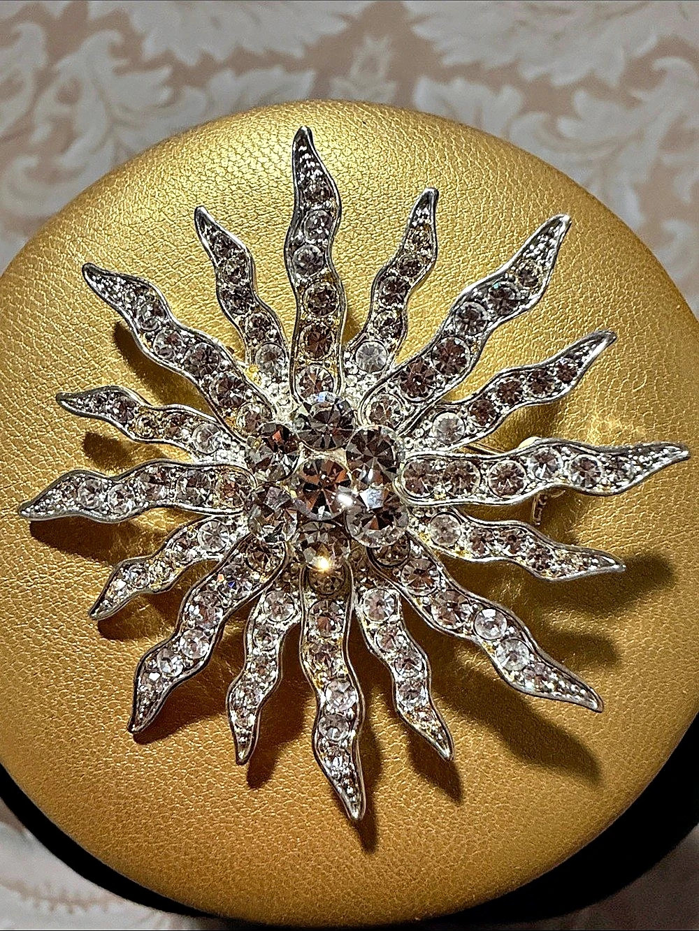 Rhinestone Sunburst Brooch in Silver